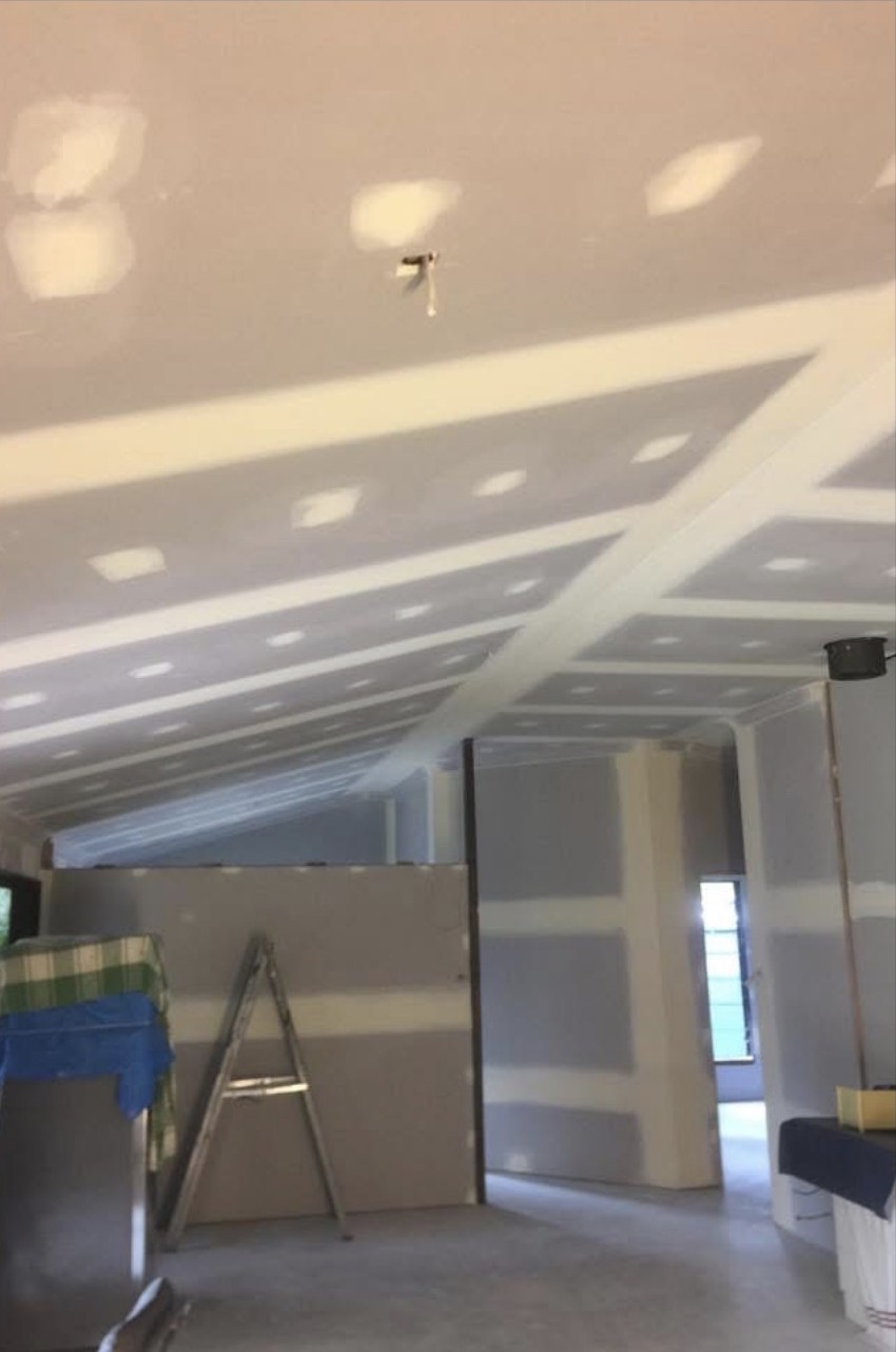 Plasterboard lining in a barn-style shed